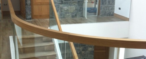 Curved Oak and Freestanding Glass Balustrade Staircase